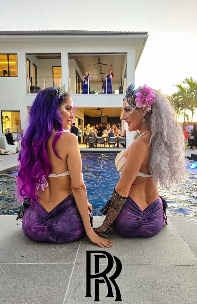 Two luxury mermaids at a Rolls-Royce event